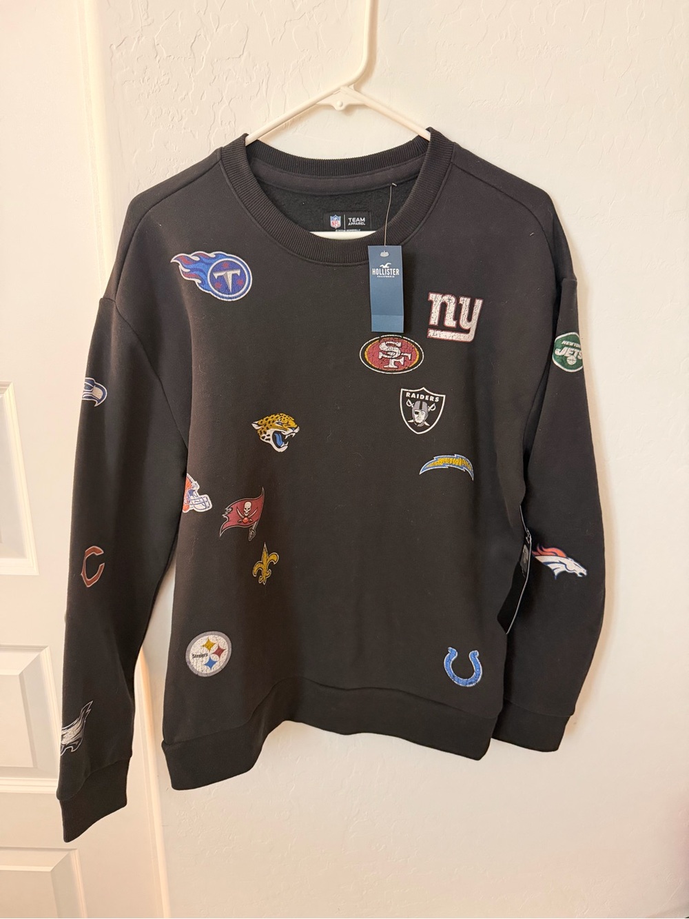NFL Black Crewneck Sweatshirt with Team Patch Logos - NFL